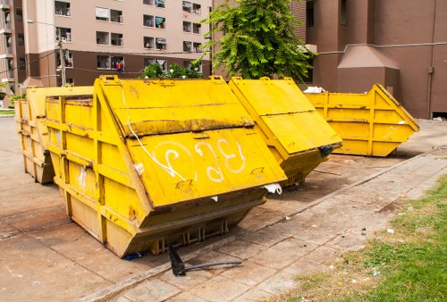 Green skips outside a Peckham street property representing eco-friendly skip hire