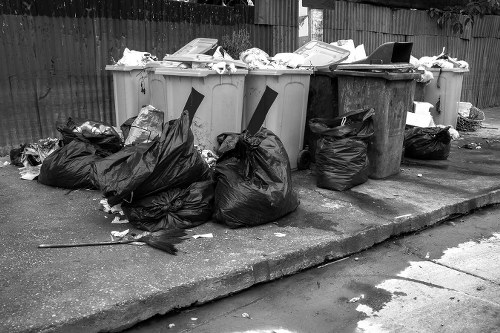 Mini skip being loaded with garden waste