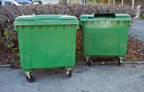 Waste management skip being loaded with household items